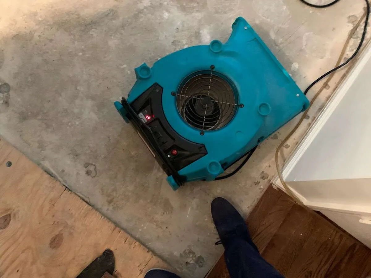 Air mover drying subfloor during Leak Detection & Repair in Darnestown